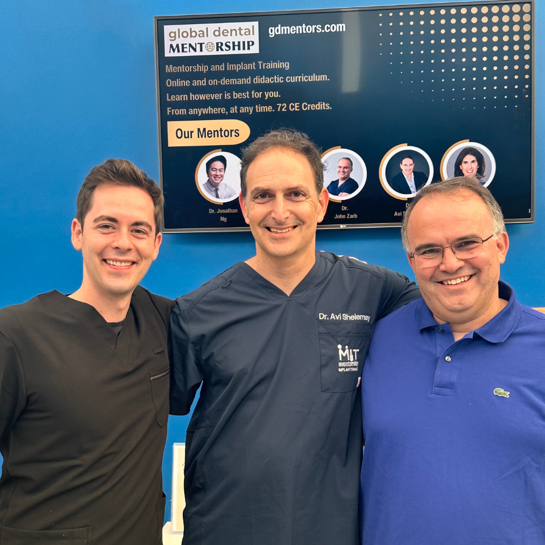 Photo of three of Global Dental Mentorship's Mentors. Left: Dr. Dave Powell, middle: Dr. Avi Shelemay, right: Dr. John Zarb. All three standing together and behind them is a TV screen showing gdmentors.com, Mentorship and Implant Training, Online and on-demand didactic curriculum. Learn however is best for you. From anywhere, at any time. 72 CE credits.
